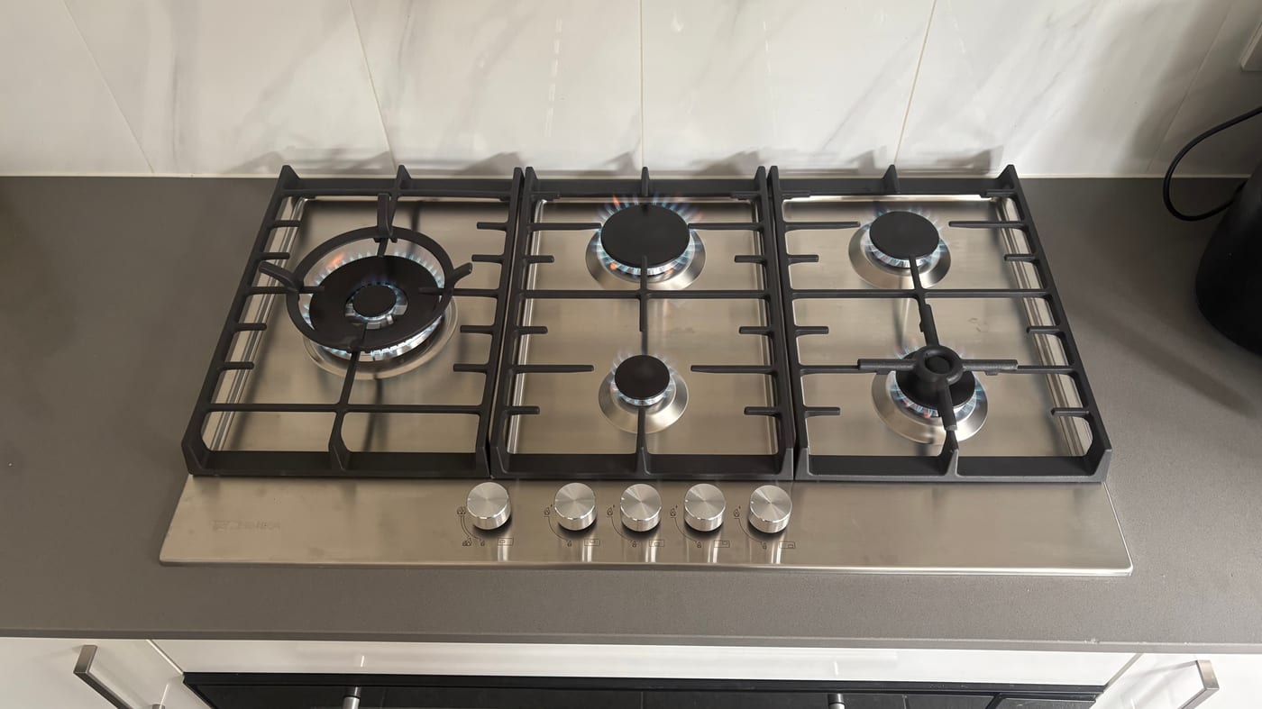 Five-burner gas cooktop installed by Pure Plumbing & Gas Solutions
